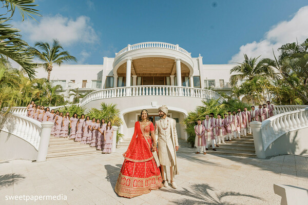 wedding party,grand entrance,resort wedding,bride and groom,destination wedding,tropical venue,luxury wedding,group portraits,wedding celebration,grand architecture