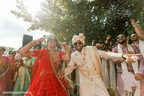 baraat,wedding procession,dancing couple,cultural traditions,groom entrance,bride dancing,festive celebration,wedding guests,destination wedding,joyful moments