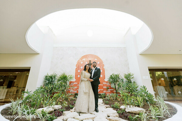 reception portraits,indoor garden,formal attire,modern venue,bride and groom,luxury wedding,contemporary architecture,elegant portraits,wedding fashion,romantic moments