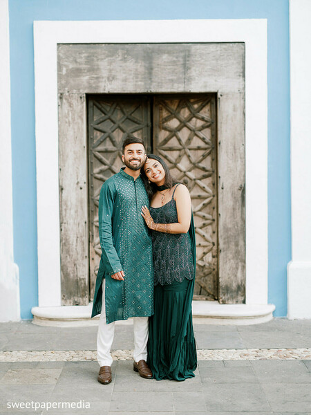 evening portraits,emerald attire,couple portraits,architectural backdrop,destination wedding,pre wedding fashion,romantic moments,coordinated outfits,outdoor portraits,luxury style