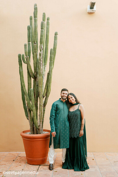 cactus backdrop,destination portraits,emerald attire,couple portraits,outdoor romance,luxury wedding,architectural venue,engagement session,coordinated fashion,tropical destination