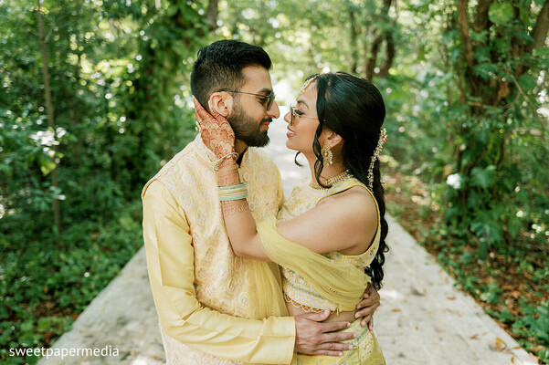 romantic couple,tropical setting,yellow attire,intimate moments,engagement portraits,pre wedding shoot,destination wedding,outdoor romance,cultural fashion,bride and groom