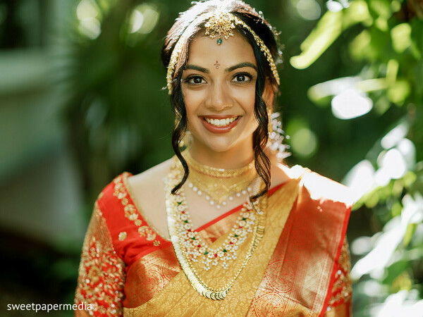 bridal portrait,red sari,bridal jewelry,south asian bride,traditional attire,bridal beauty,cultural fashion,wedding preparations,elegant portrait,bridal styling