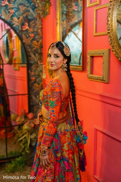 bridal portraits,colorful lehenga,wedding fashion,bride style,artistic backdrop,south asian bride,pre wedding portraits,bridal jewelry,fashion photography,vibrant decor