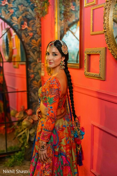 bridal portraits,colorful lehenga,wedding fashion,bride style,artistic backdrop,south asian bride,pre wedding portraits,bridal jewelry,fashion photography,vibrant decor