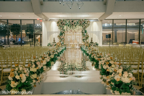 wedding ceremony,ceremony decor,floral decor,luxury wedding,wedding venue,mirrored aisle,reception decor,wedding stage,event design,indian wedding