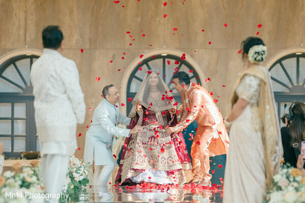 bridal entrance,bride alone,wedding ceremony,rose petals,ceremony moments,bridal fashion,indian wedding,family moments,wedding traditions,candid moments
