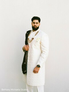 Groom in Cream Sherwani with Black Shawl and Gold Jewelry