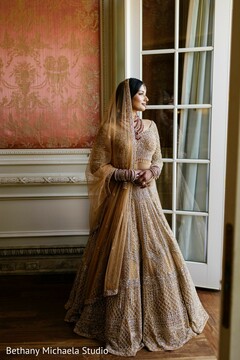 Bride in Gold Lehenga by Window