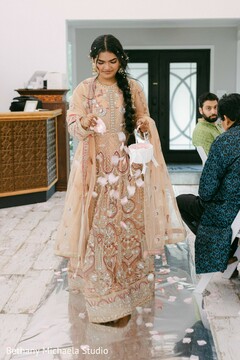 Flower Girl Scattering Petals Down Aisle