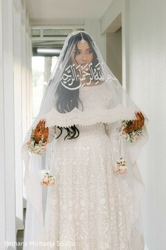 Elegant Bridal Portrait with White Embroidered Veil & Floral Garlands