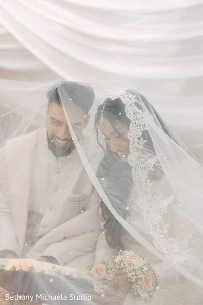 wedding,couple,white wedding dress,veil,bridal bouquet,white attire,elegant wedding,wedding photography,intimate moment,wedding portrait