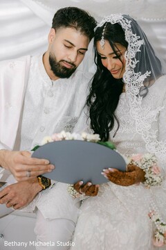 Couple holding decorative plate
