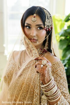 Bride in Gold Attire with Intricate Jewelry