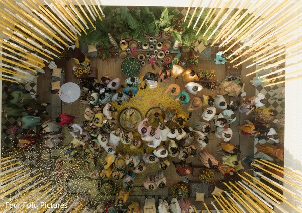 haldi ceremony,aerial photography,drone shot,wedding guests,floral decor,pre wedding rituals,indian wedding,celebration,yellow decor,destination wedding