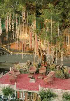 Outdoor Wedding Lounge with Pink Seating and Floral Decor
