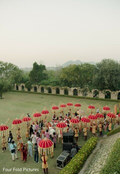 Outdoor Gathering with Red Umbrellas