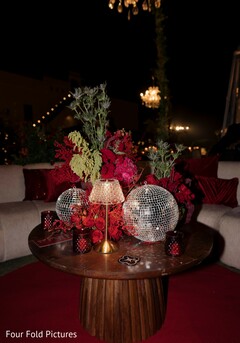 Red Floral Decor with Disco Balls for a Night Event