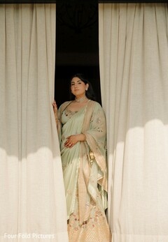 Bride in Mint Green Saree with Embroidered Blouse and Choker Necklace