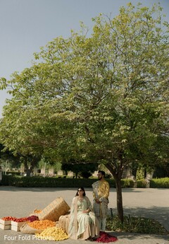 Couple Poses Under Tree with Floral Decor