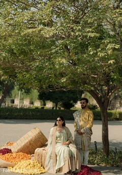 Couple's Outdoor Photo Session with Flower Petals and Greenery
