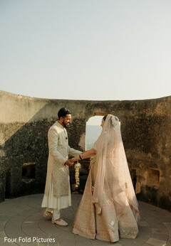 Couple's Portrait in Traditional Attire at Historic Venue