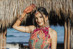 Woman in Halter Top with Peacock Print and Mehndi