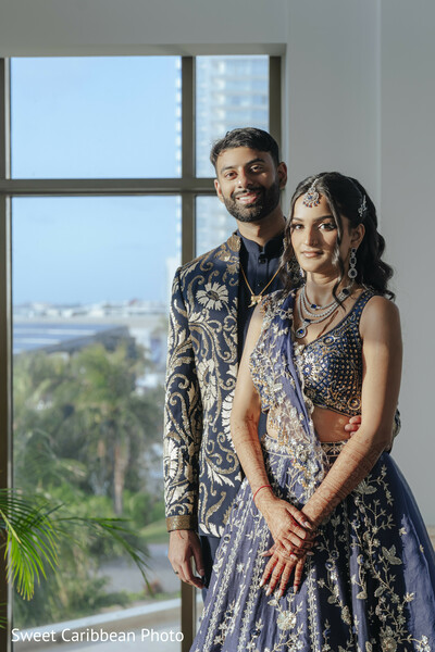navy blue lehenga,embroidered sherwani,bridal jewelry,groom fashion,bridal fashion,couple portrait,city view,mehndi,bridal hairstyle,maang tikka