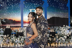 Couple in Navy Blue Outfits with Floral and Candle Decor
