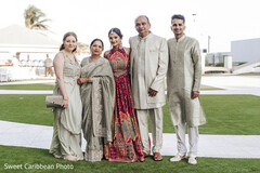 Family poses on a lawn
