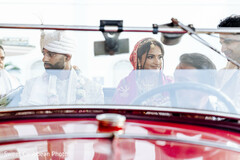Couple in Red Vintage Car, Groom in Turban, Bride in Pink Attire