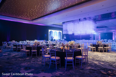 Elegant Reception Decor with Purple Lighting and Chandeliers