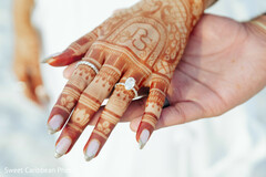 Close-up of bridal mehndi and engagement ring