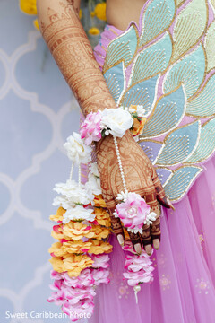 Bridal Mehndi with Floral Jewelry and Pink Attire Details