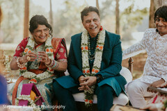 People in Traditional Attire with Floral Garlands