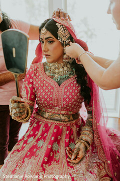 Bride in Pink Lehenga with Intricate Jewelry and Veil
