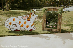 Outdoor Wedding Decor with Cow Cutout and Mirror Signage