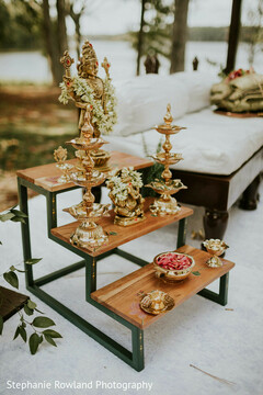 Outdoor Ceremony Altar with Brass Deities and Floral Accents