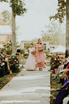 Flower Girls in Pink Outfits Walk Down Outdoor Aisle
