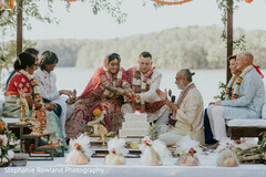 Couple in Traditional Attire by Lake during Ceremony