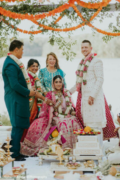 Outdoor Ceremony with Pink Lehenga and Floral Garlands
