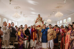 Bride on a raised platform during a ceremony