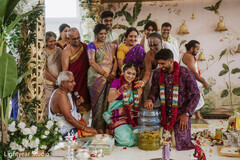 Couple with family during a ceremony