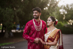 Couple's Portrait: Red Kurta, White Saree, and Pearl Necklace