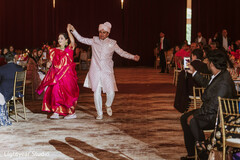 Couple dancing in traditional attire at a wedding celebration