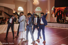 Wedding Party Performance on Dance Floor with Stage Decor