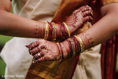 Bridal Mehndi with Gold and Red Bangles