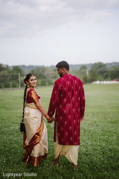 Couple walking outdoors on green grass