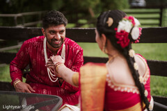 Couple in Red Traditional Attire Outdoors