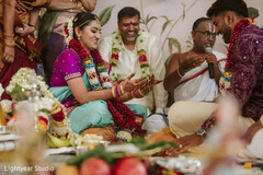 Couple participating in a South Asian wedding ceremony